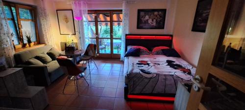 a bedroom with a bed with shoes on it at Ferienwohnung Chiemgau - erleben in Siegsdorf
