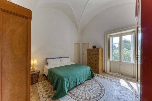a bedroom with a bed and a window at Luisa in Leuca