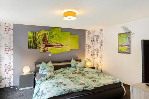a bedroom with a bed and a tv at Lieblingsgast in Klötze