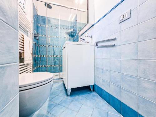 a bathroom with a toilet and a shower at Villa Galatea La Conchiglia in Capoliveri