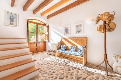 a living room with a couch and stairs at Casa Amber in Sóller