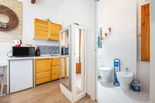 a bathroom with a sink and a toilet in it at Alla Marina Cagliari in Cagliari