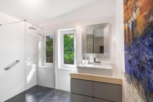 a bathroom with a sink and a mirror at Finca El Dragonal With Private Pool in Santa Brígida