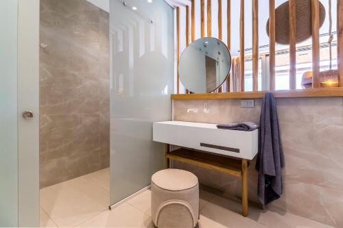 a bathroom with a sink and a mirror at Studio Yvonne in Meganisi