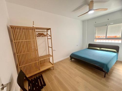 a bedroom with a bed and a ladder in it at La Coqueta in Zarandona