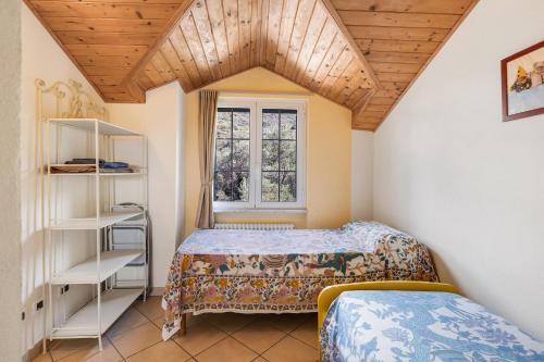 a bedroom with two beds and a window at La Casa di Lady in Ceriale