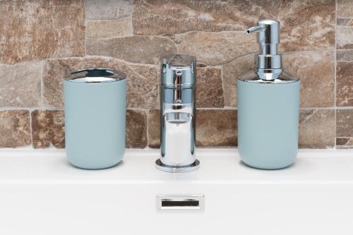 a kitchen sink with two toothbrushes at Gustalu in Dorgali