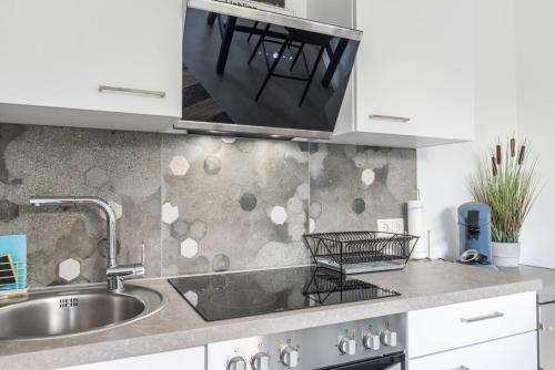 a kitchen with a sink and a counter top at Landtraum 17 in Wittenhofen