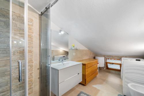 a bathroom with a sink and a shower at Casa Eleonora in San Sperate