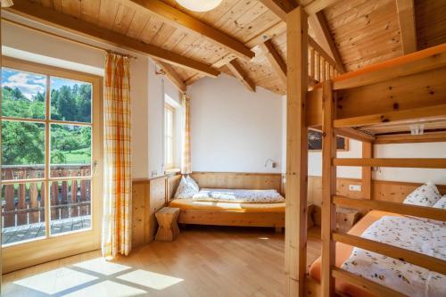 a room with two bunk beds and a window at Ferienhaus Hof am Schloss in Prato allo Stelvio