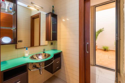 a bathroom with a sink and a mirror at Casa Mulet in Can Picafort