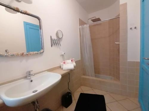 a bathroom with a sink and a shower at Costa dei Monaci Villas - Tropea in Parghelia