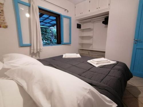 a bedroom with a bed with towels on top of it at Costa dei Monaci Villas - Tropea in Parghelia