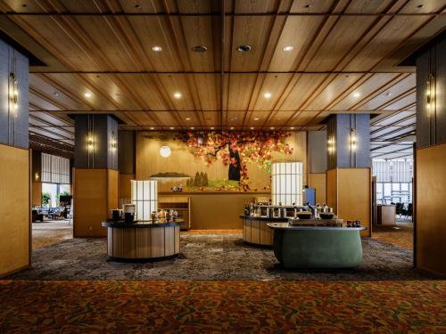 a lobby of a hotel with aasteryasteryasteryasteryasteryasteryasteryasteryastery at HanaMOMIJI in Jozankei