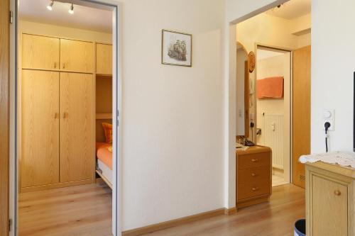 a mirror in a room with a bedroom at Ferienwohnung Wagner mit 35 qm Fr in Bad Bellingen