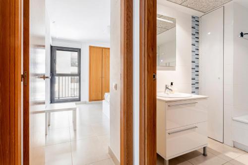 a bathroom with a sink and a mirror at Valencia Playa in Valencia