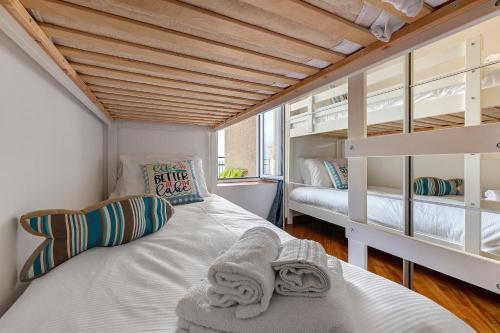 a bedroom with two bunk beds in a room at La Gabbianella - Lake Como in Argegno