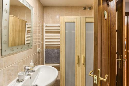 a bathroom with a sink and a mirror at Cal Tatanet in Sant Pau de Segúries
