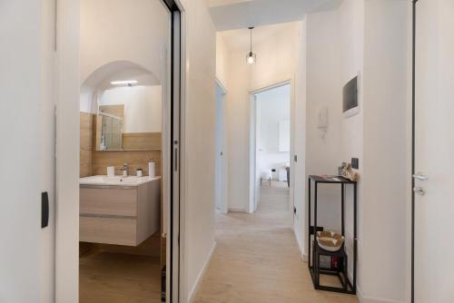 a bathroom with a sink and a mirror at Villa Lilia in Arona