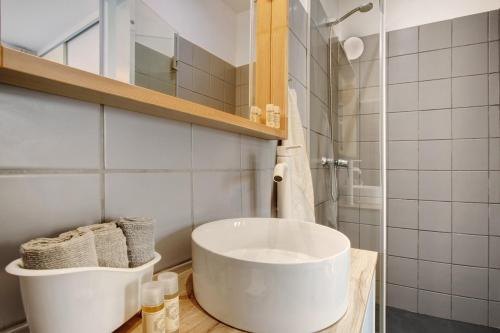 a bathroom with a large white tub on a counter at Casa do Loureiro in Funchal