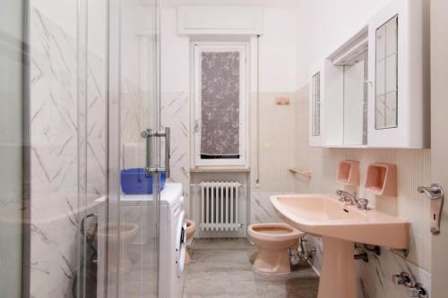a bathroom with a toilet and a sink and a shower at Gravedona Holiday - Lake Como in Consiglio di Rumo