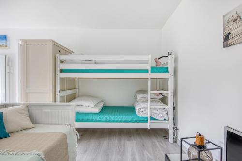 Llit o llits en una habitació de Studio Judicaelle
