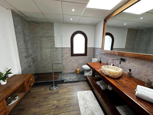 a bathroom with a sink and a mirror at Villa Retreats in Santa Eularia des Riu