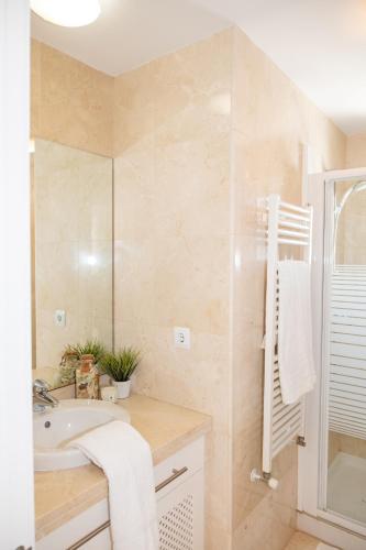 a bathroom with a sink and a shower at Casa Trebol - Private Pool Villa in San Javier