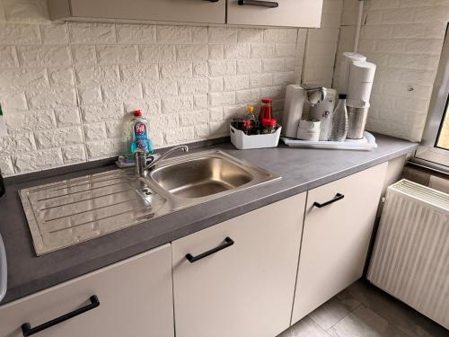 a kitchen with a sink and a counter top at Rosenhaus in Merchweiler