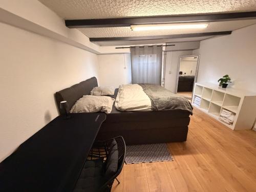 a bedroom with a large bed in a room at Rosenhaus in Merchweiler