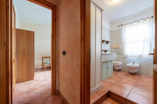 a bathroom with a toilet and a sink at Brezza di Mare in Calasetta