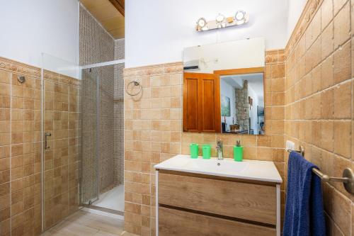a bathroom with a sink and a shower at S' Alzina in Sencelles