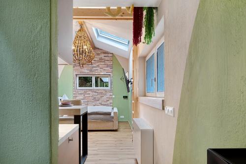 a hallway of a house with a bedroom at Tiny House am Kaiserstuhl in Ihringen