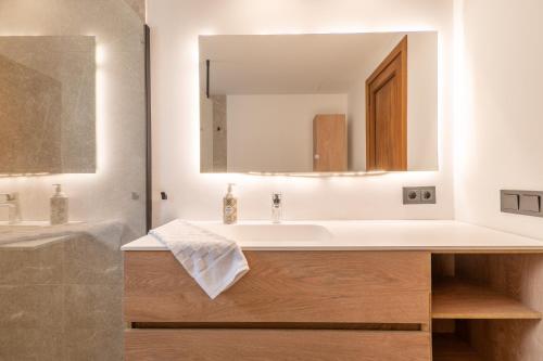 a bathroom with a sink and a mirror at Villa Ana Puerto Pollensa in El Port