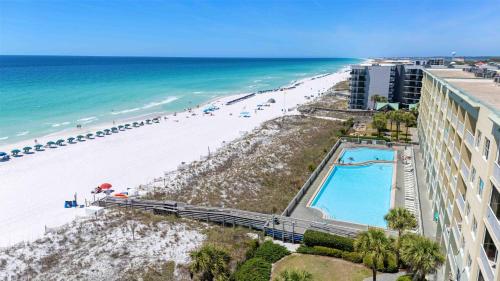 a view of the beach from the balcony of a resort at Gulf Front condo with Beach access and shared Pool in Fort Walton Beach