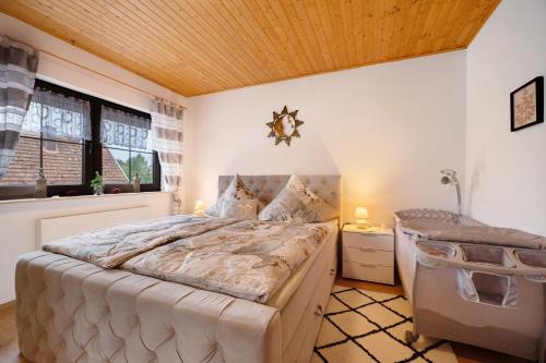 a bedroom with a bed and a window at Betty’s Home in Gersheim