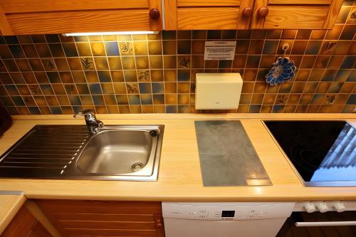 a kitchen with a sink and a counter top at Haus Titisee in Löffingen
