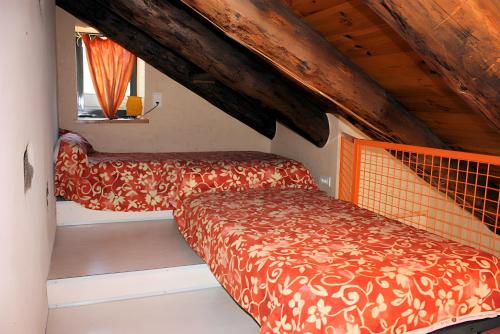 a small room with a bed and a window at Gîte De La Poucinière in Saint-Sauves- dʼAuvergne
