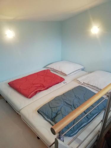 two bunk beds in a small room with two at Loewe Bad Frankenhausen in Bad Frankenhausen