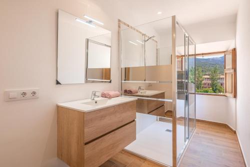 a bathroom with a sink and a shower at Casa Tramuntana in Sóller