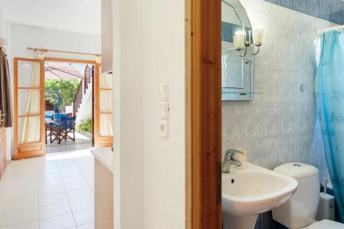 a bathroom with a sink and a toilet at Studios Asterias 2 in Astypalaia