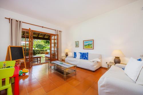 a living room with a couch and a table at Can Toni in Pollença