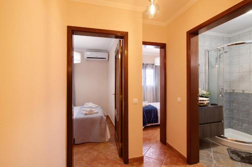 a bathroom with a shower and a sink and a tub at At-tunis in Tunes