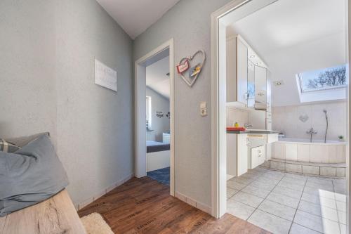a bathroom with a tub and a sink and a toilet at Ferien Im Vierth in Buchholz