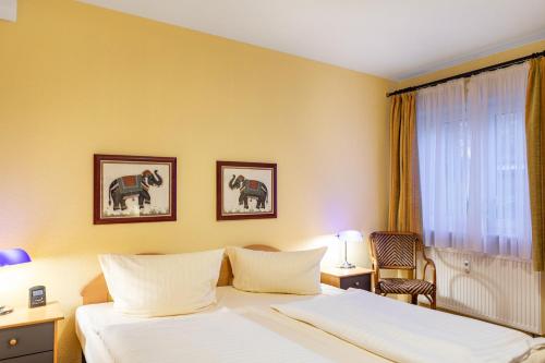a hotel room with a bed and a window at Ferienwohnung Tannenblick 1-2 in Oberhof