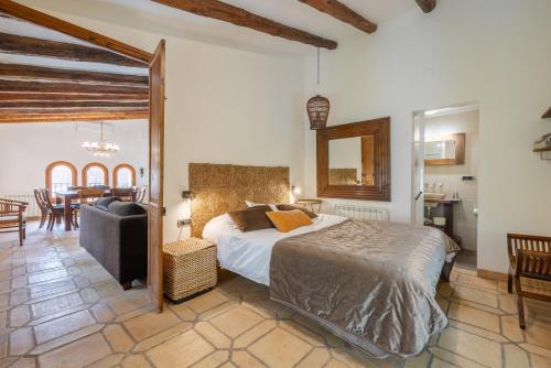 a bedroom with a bed and a dining room at Casa Argentera Full House in Argentera