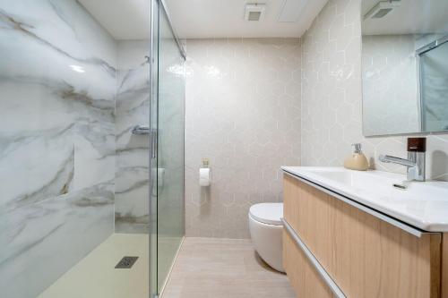 a bathroom with a shower and a toilet and a sink at Logroño in Salou