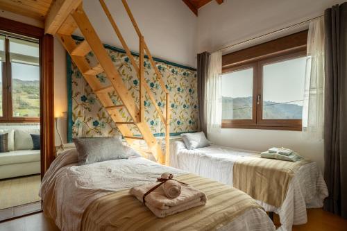 a bedroom with two beds and two windows at Casa Carmen in La Vega