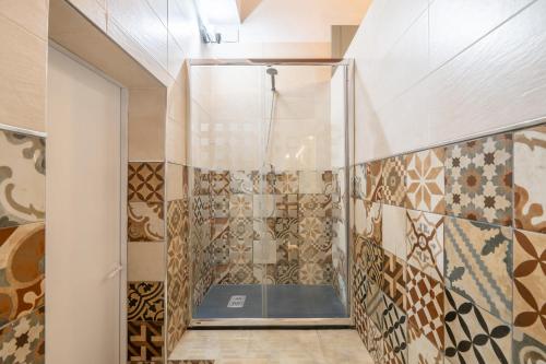 a shower with a glass door in a bathroom at Moli dels Reis in Palma de Mallorca