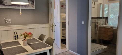 a dining room with a table and a sink at Ferienhaus Haffschatz in Ueckermünde